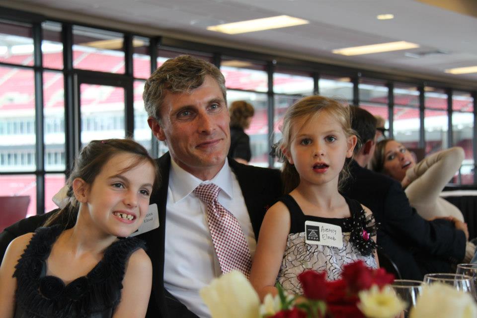 Russ Elrod at the EMBA graduation reception with his two daughters, Hensley and Aubrey, 