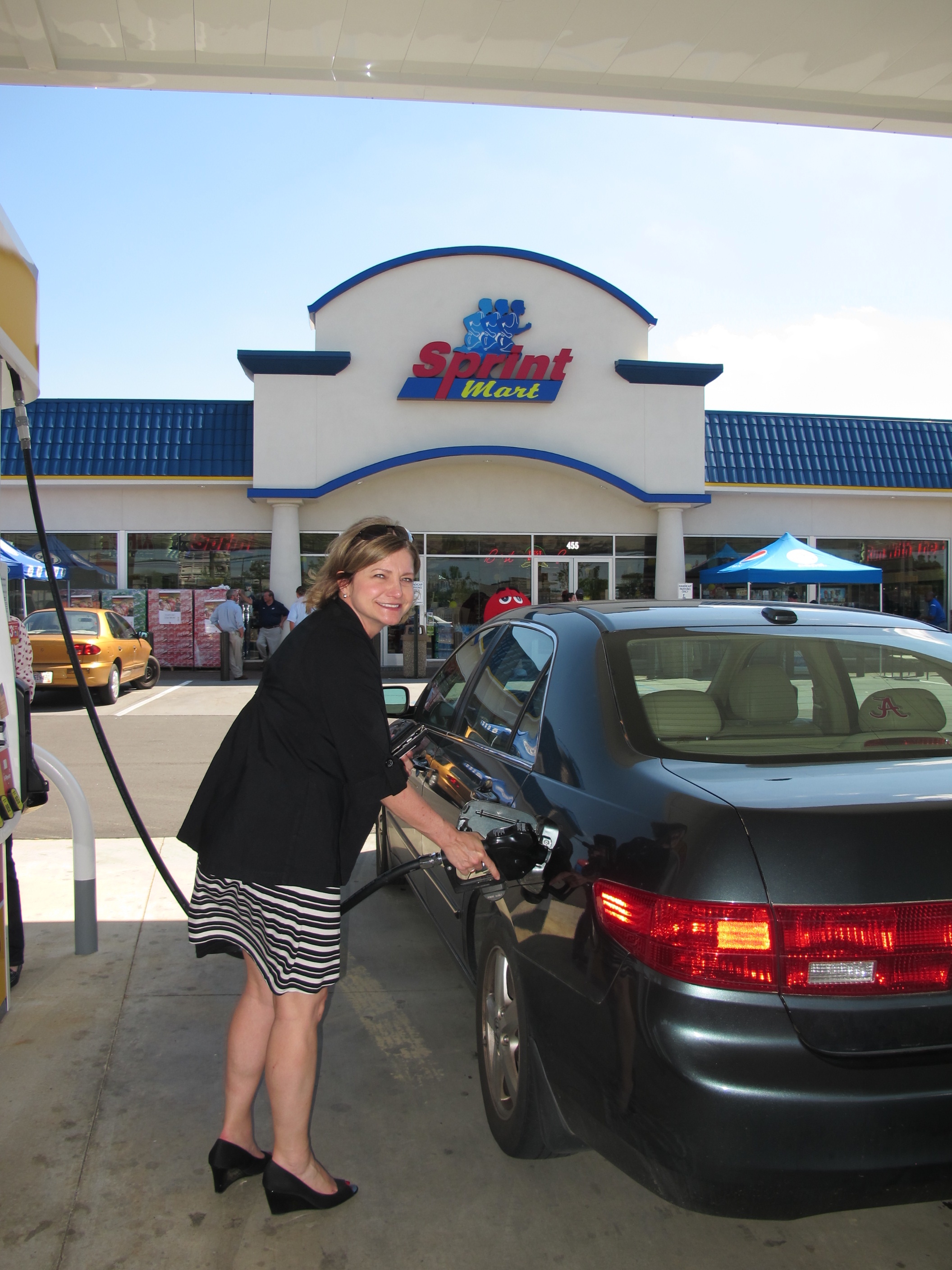 Cheryl Altemara, EMBA Assistant Director, fills up at Grand Opening.