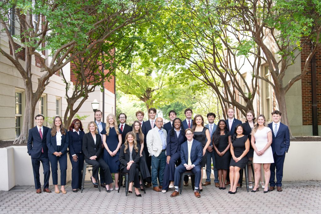 A group of students posing in an outdoor setting.